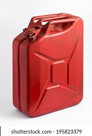Red metal fuel tank or jerry can for transporting and storing gasoline or diesel fuel on a white background