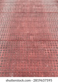 Red Metal Grid Texture Background with Geometric Square Pattern