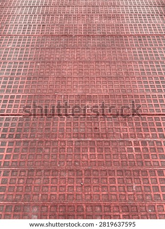 Red Metal Grid Texture Background with Geometric Square Pattern