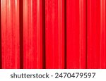 Red metal roof surface texture and background design. Surface red metallic cargo container shiny for shipping and transportation background painted shutter or blind roller security shutters roofing