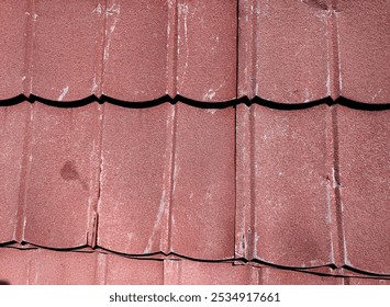 Red metal roof tiles arranged. Background photo, texture. Terracotta roof tiles arranged in a symmetrical, wavy pattern - Powered by Shutterstock