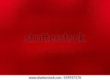 Red metallic foil paper texture background. Close up