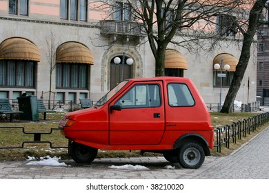 Red Microcar On The Street