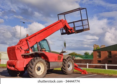 Red Mobile Cherry Picker Into Blue Sky