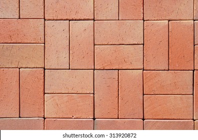Red Modern Ceramic Clinker Pavers. Floor pavers in a path, detail of a pavement to walk, textured background