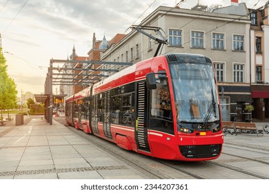 Red modern tram in the center of Katowice, Poland