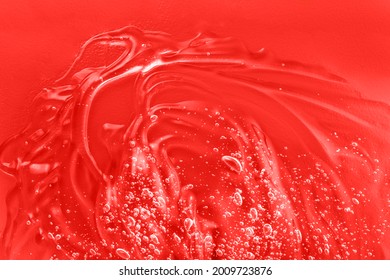 Red Moisturizer Smear Smudge. Gel Texture With Bubbles. Jelly Cleanser Cosmetic Product. Serum Liquid Cosmetics, Cream With Collagen Sample. Hyaluronic Acid Toner With Retinol Swatch. Close-up, Macro