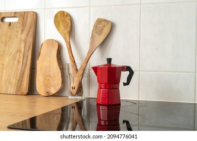 Red Moka Pot On An Electric Stove In A Minimalist Kitchen. Fresh Morning Stovetop Espresso