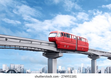 Red Monorail Train Against Blue Sky And Modern City In Background