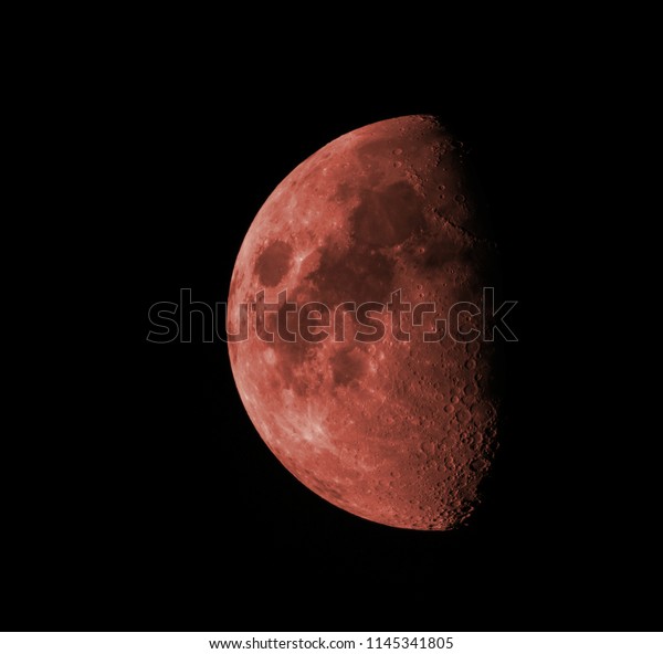 Red moon in the black\
sky.