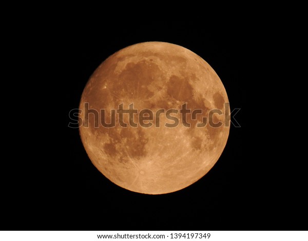 Red moon in the night\
sky