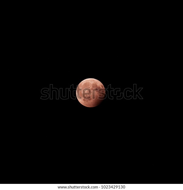 Red Moon on black\
sky