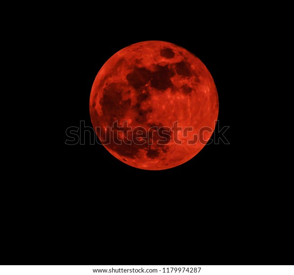 Red moon real / full blood moon on black\
sky dark background - selective\
focus