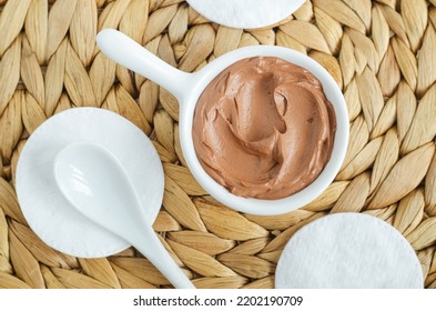 Red Moroccan Bentonite Clay In A Small White Bowl And Cotton Pads. Diy Facial Or Hair Mask, Body Wrap Recipe. Natural Beauty Treatment And Spa. Top View, Copy Space. 