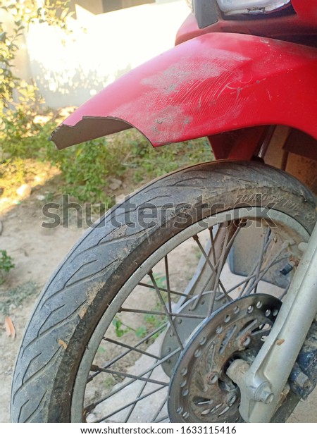 The red motorcycle\
that had an accident