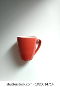 Red Mug Ceramic On The White Table