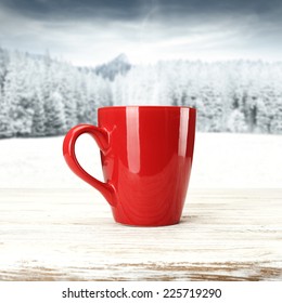 Red Mug Of Coffee And Snow 