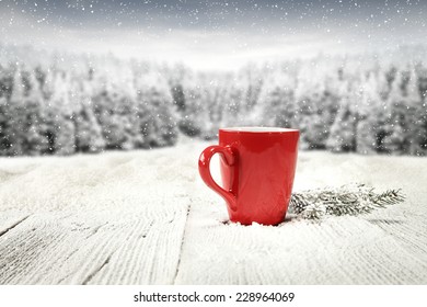 red mug of coffee and tree of green  - Powered by Shutterstock