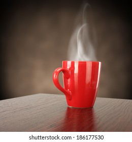 Red Mug And Smoke With Coffee 