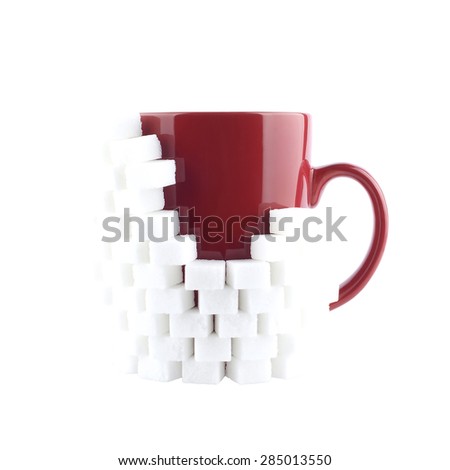 Red mug with sugar on a white background