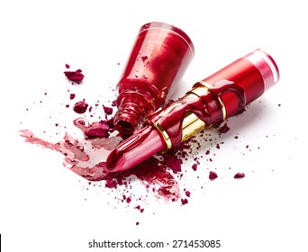 Red Nail Polish, Crushed Eye Shadow And Lipstick Isolated On White Background