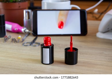 Red Nail Polish. Mobile Phone, Ultraviolet Lamp.