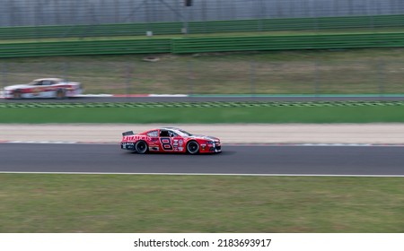 Red Nascar Car Racing Action On Track Blurred Motion Background.. Vallelunga, Italy, October 29 2021. American Festival Of Rome