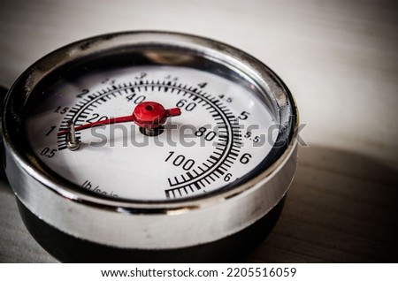 red needle of the barometer
