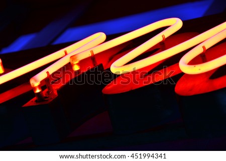 Red neon light (closeup on old sign)