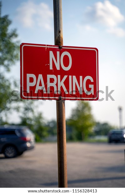 Red No Parking\
Sign