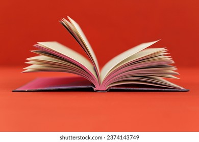 red notebook on a red background