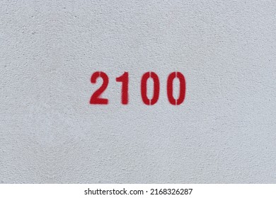 Red Number 2100 on the white wall. Spray paint.