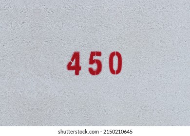 RED Number 450 on the white wall. Spray paint.