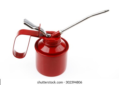 Red oil can on plain background