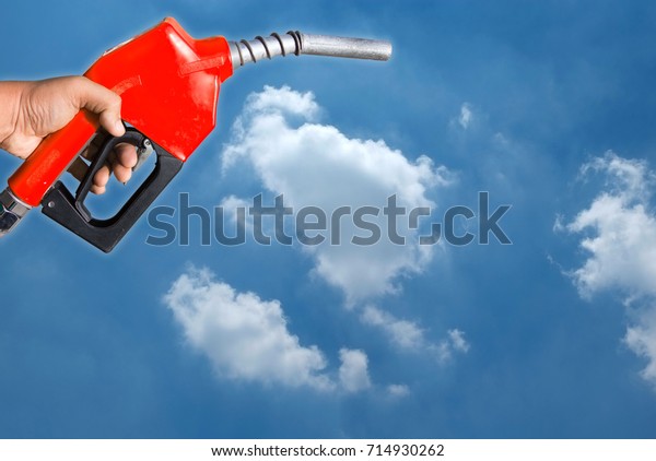 Red oil\
dispenser Separated from the sky\
background