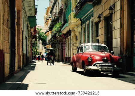 Red old car in the streets of Havana Cuba