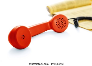 Red old phone and phone directory -Clipping Path