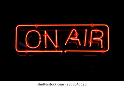 Red on air neon text on black background - Powered by Shutterstock