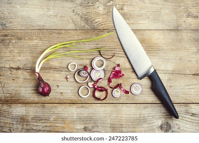 Red Onion Chopped On A Wooden Background. View From Above.