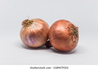 Red Onion Isolated On White Background. Fresh Root Vegetables.