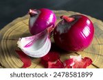 Red onion on an old background, a spicy vegetable, for preparing delicious healthy food. Healthy natural food high in vitamins.