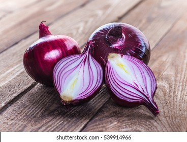 red onions on rustic wood - Shutterstock ID 539914966