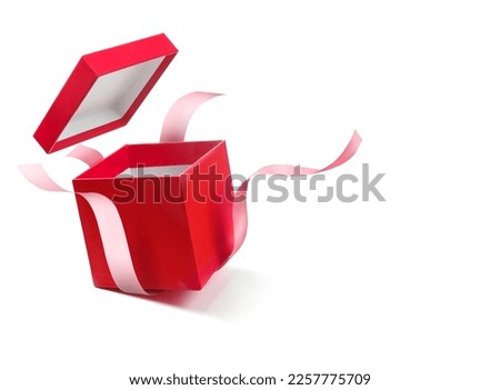 Red open gift box with pink ribbon isolated on a white background