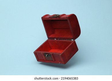 Red open pirate chest flying in antigravity on blue background with shadow. Levitation object in the air. Creative minimal layout - Shutterstock ID 2194065383