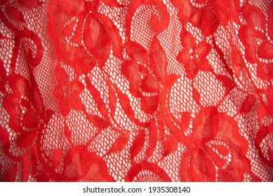 Red openwork fabric with flowers