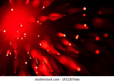 red optical fibre in dark selective focus and kinda looks like coronavirus