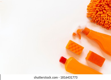 Red and orange colorfut set of cleaning tools on the white background. Clean up concept. Flat lay of domestic cleaning kit - Powered by Shutterstock