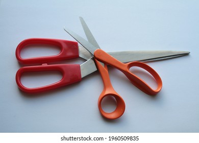 Red And Orange Scissors Stuck Together