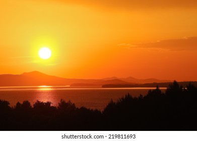 Red And Orange Sunset By The Sea