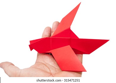 Red Origami Bird Sitting On The Hand.